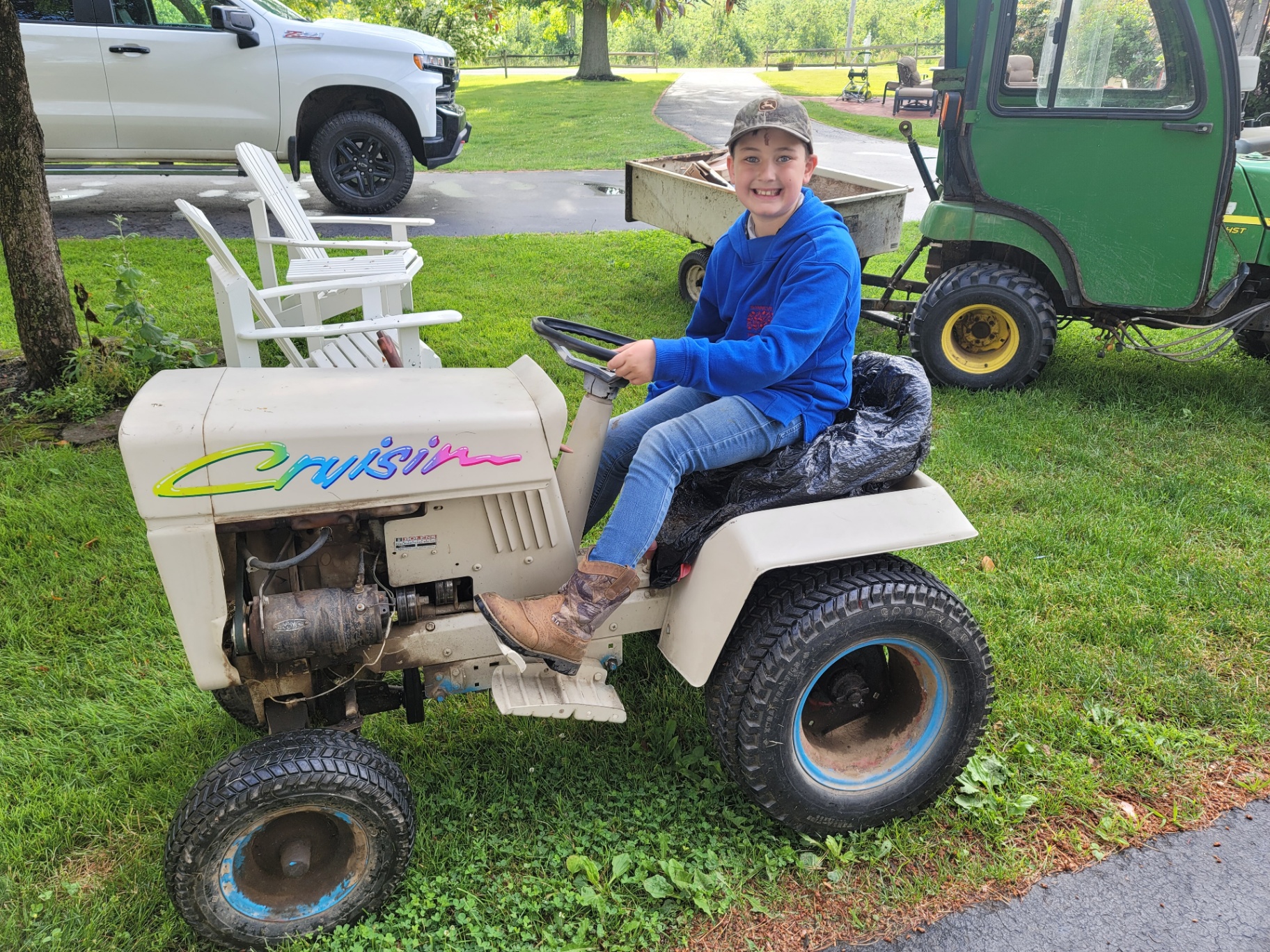 Casen on his mini 'Cruisin' garden tractor
