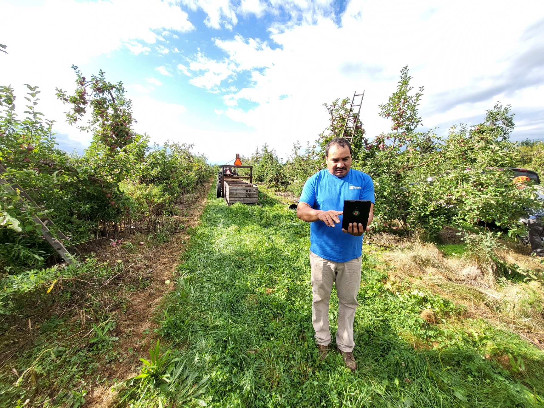Manuel using Agri-Trak to track farm data during harvest