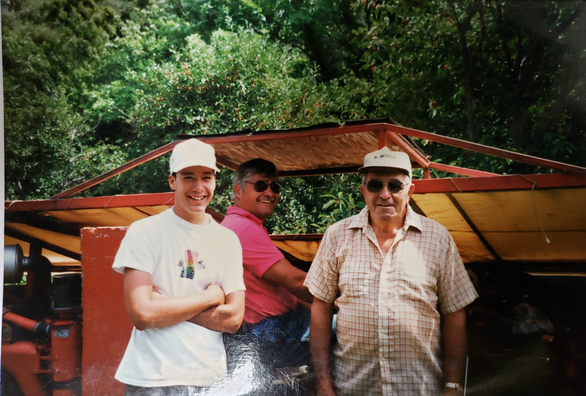 Three generations of the Sonneville family shaking sour cherries