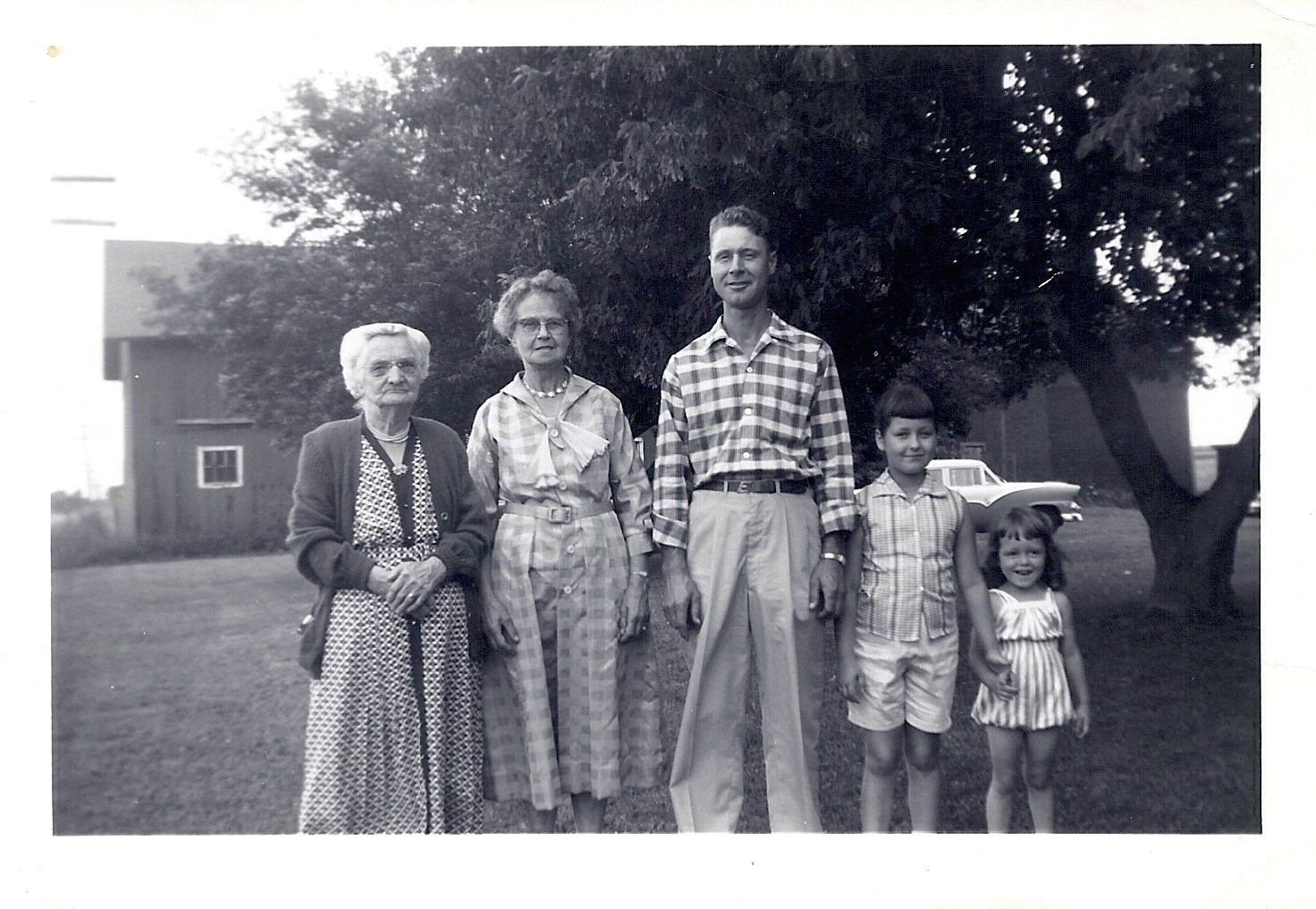 Adeline, Clara, Ed, Deanie and Rhonda outside the family barn in 1958
