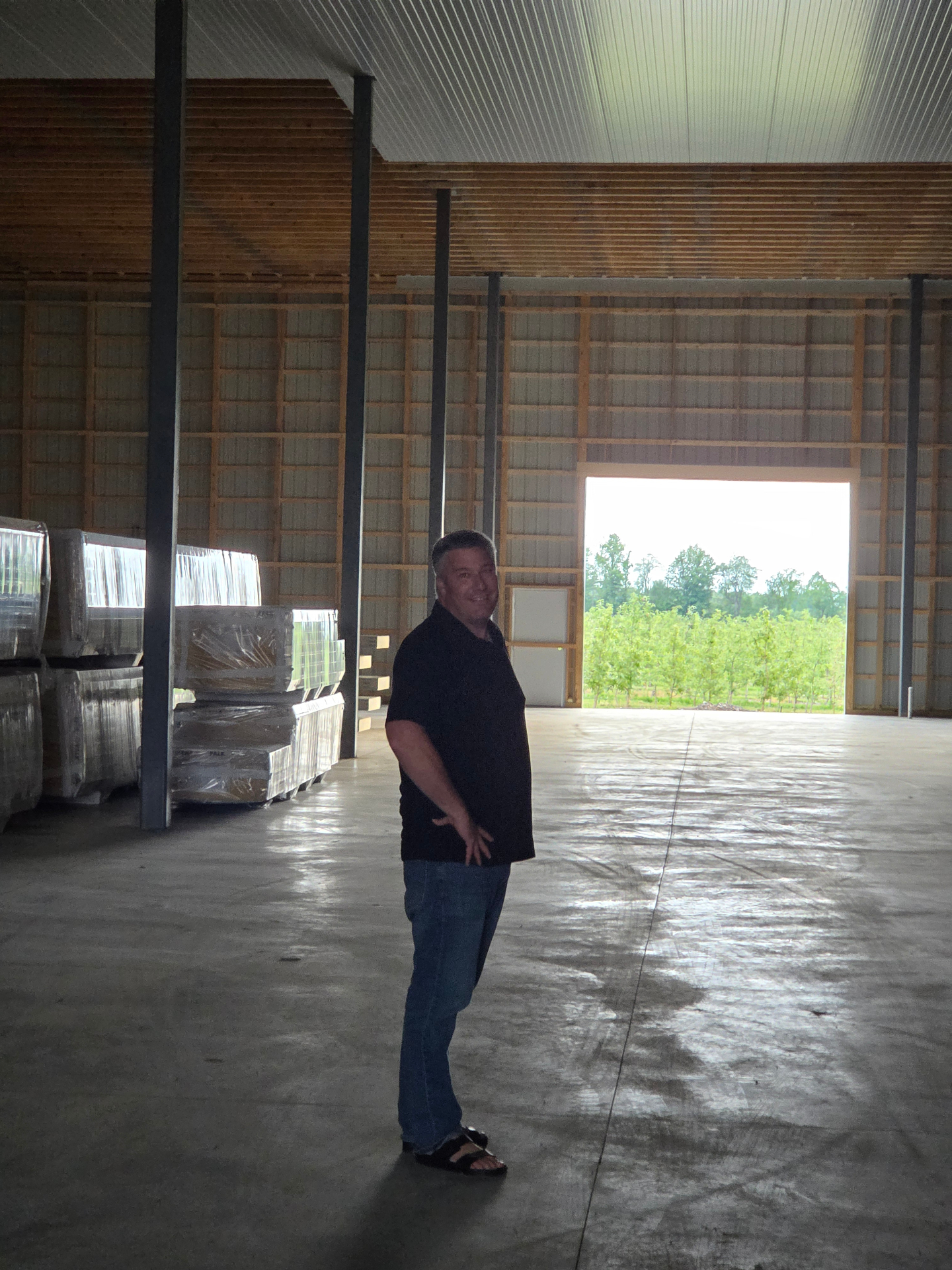 Jason inside the new Controlled Atmosphere storage building under construction